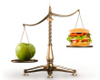 ist1_1699255-apple-and-hamburger-on-scales-conceptual